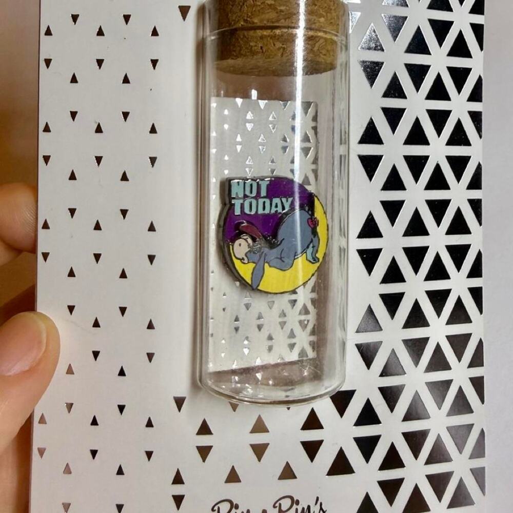 Disney Eeyore "Not Today" pin in a glass bottle